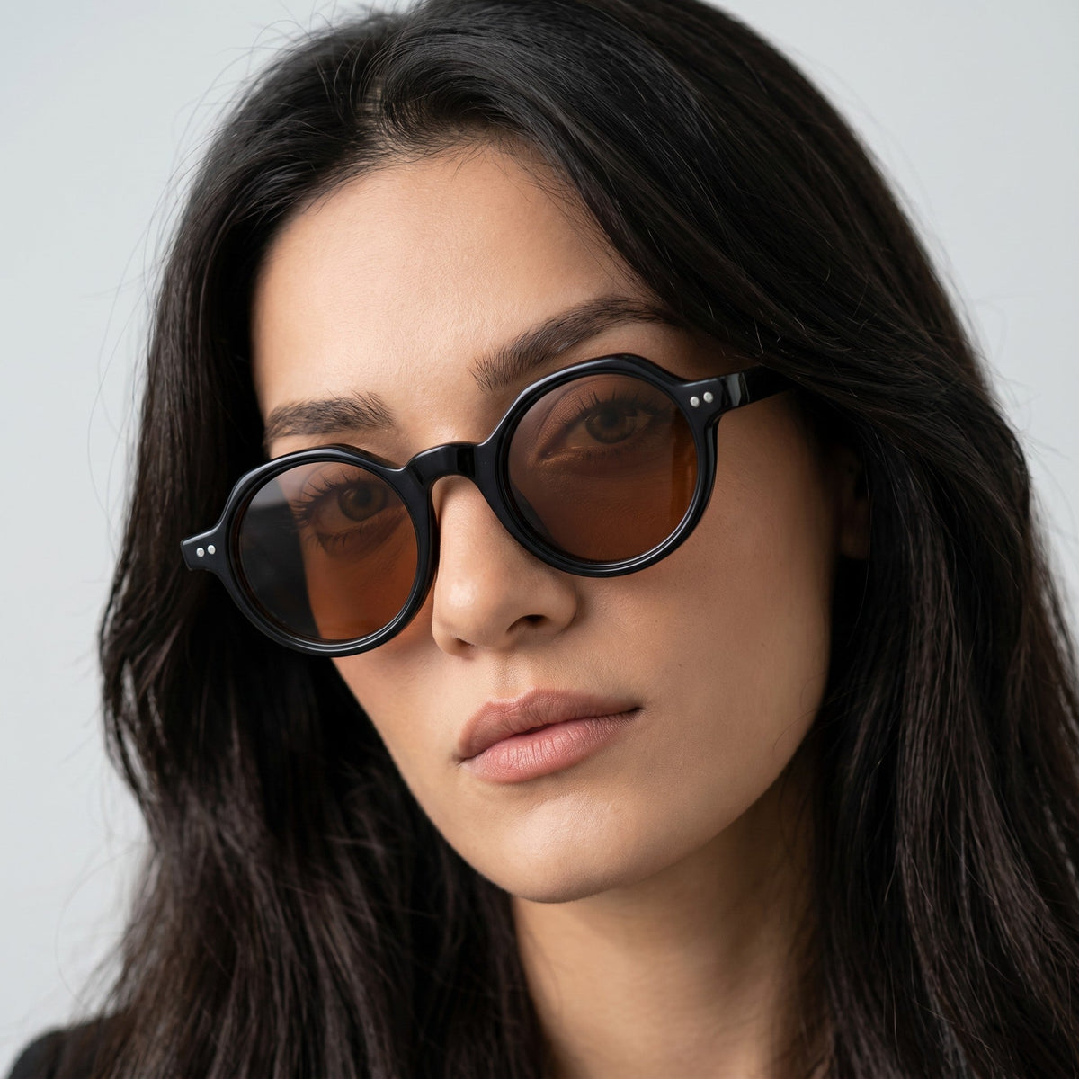 Nadaraty Eyewear Horus Inferno H 139 black acetate round sunglasses with brown polarized lenses.