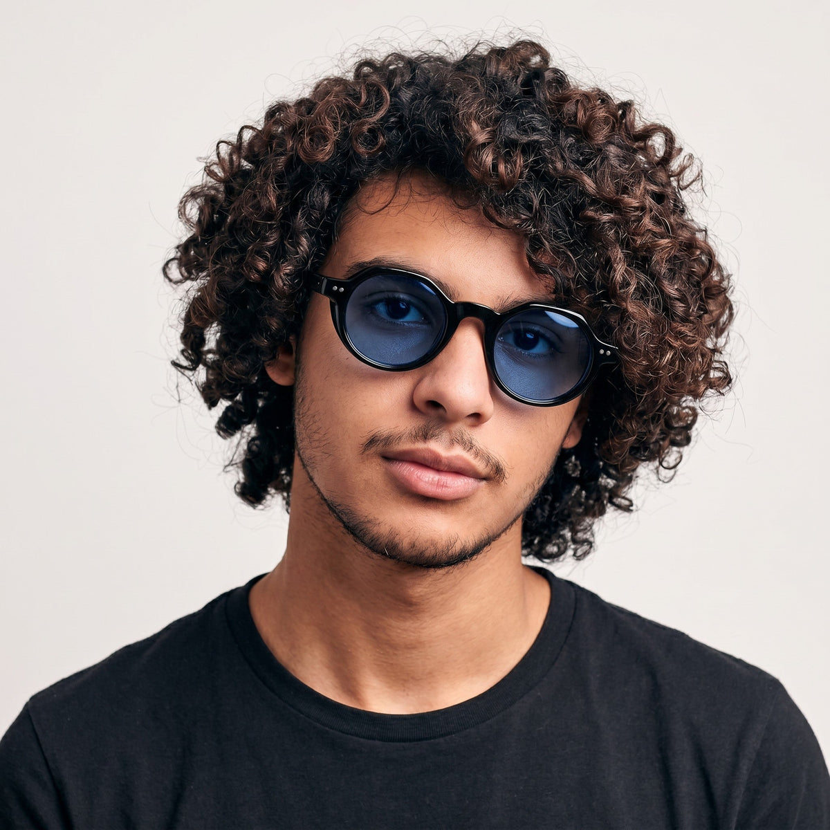 Nadaraty Eyewear Horus Inferno H 139 black acetate round sunglasses with blue polarized lenses.