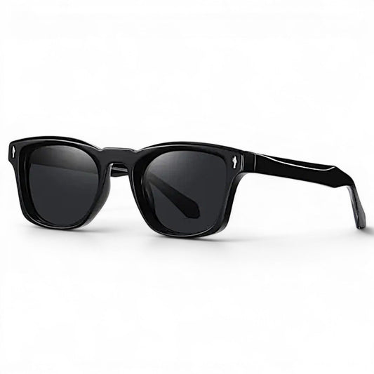 Nadaraty eyewear Horus Kaizen H 152 black acetate sunglasses with bottle green lenses and signature metal rivets.