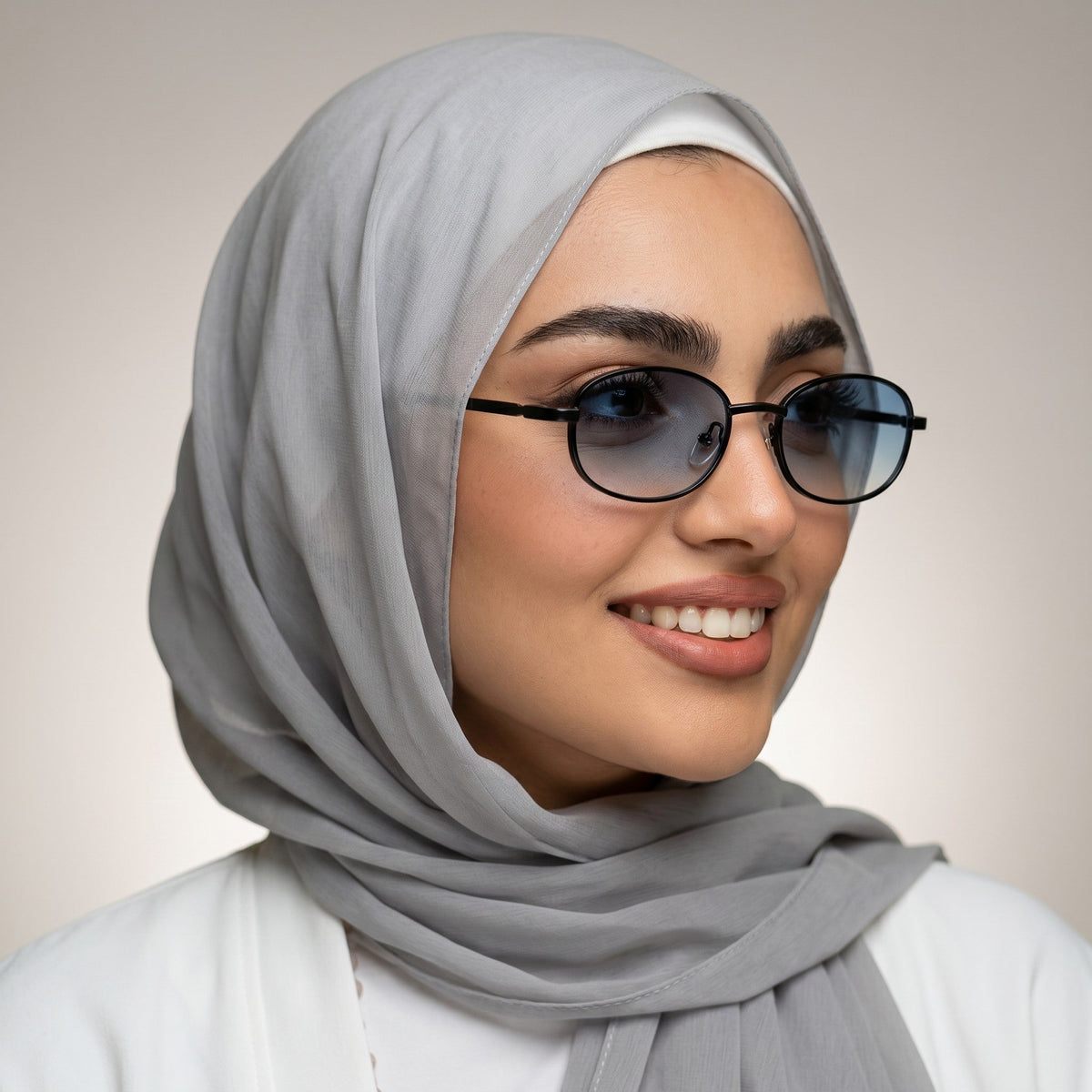 nadaraty eyewear Horus Wolf H 191 oval sunglasses with black metal frames and blue gradient lenses.